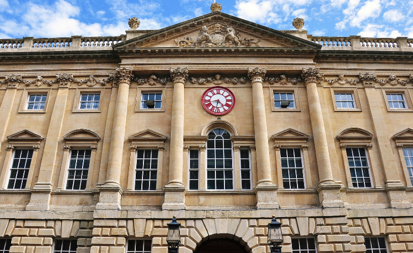 Front of Bristol Corn Exchange with the clock showing Bristol local time